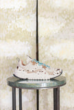 Sneakers Wave Woman di Flower Mountain realizzata in un raffinato mix di suede, nylon e pony hair nel sofisticato abbinamento Milk, Black e Brown da Donna