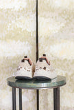 Sneakers Wave Woman di Flower Mountain realizzata in un raffinato mix di suede, nylon e pony hair nel sofisticato abbinamento Milk, Black e Brown da Donna