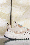 Sneakers Wave Woman di Flower Mountain realizzata in un raffinato mix di suede, nylon e pony hair nel sofisticato abbinamento Milk, Black e Brown da Donna