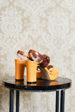 sandalo alto con plateau e tacco 105 della maison greige color giallo ocra e rame ss24