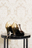 Dècolleté T-strap nero e bronce di La Belle con tacco 065 fw23