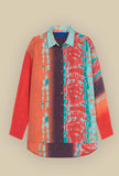Plis Over-Shirt di Mes Demoiselles Paris realizzata in morbida e leggera seta nel vivace motivo Psychedelic Sunrise da Donna