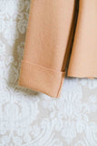 Giacca incrociata in morbido panno di lana color beige raiz della maison niù