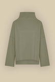 Maglia Polo di Niù realizzata in morbido jersey di lana nell’esclusiva tonalità Ike Green da Donna