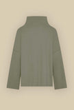 Maglia Polo di Niù realizzata in morbido jersey di lana nell’esclusiva tonalità Ike Green da Donna