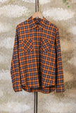 Tartan incontra un’estetica contemporanea nella nuova Camicia Tripi di Officina 36 realizzata in morbida flanella nella calda tonalità Orange da Uomo