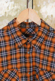 Tartan incontra un’estetica contemporanea nella nuova Camicia Tripi di Officina 36 realizzata in morbida flanella nella calda tonalità Orange da Uomo
